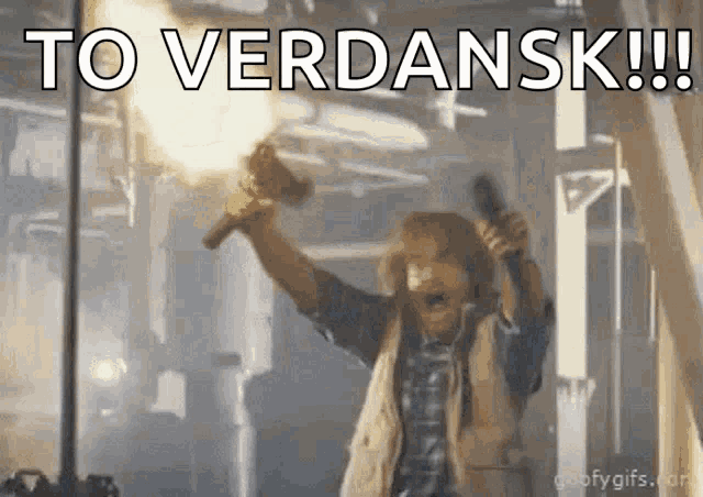 a man is holding a torch in his hand and says to verdansk !!!