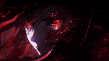 a close up of a person 's face with red eyes and a black background