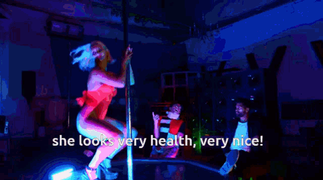a man says she looks very health very nice while another man looks on