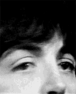 a close up of a person 's face with their eyes closed .