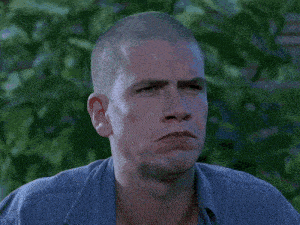 a man with a shaved head has 1100 written on his face