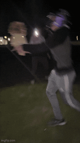 a blurry picture of a baseball player holding a bat with imgflip.com at the bottom