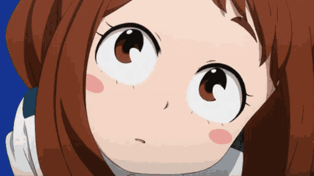 a close up of a girl 's face with big eyes