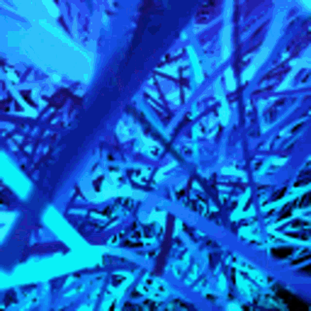 a blue background with a lot of branches and leaves .