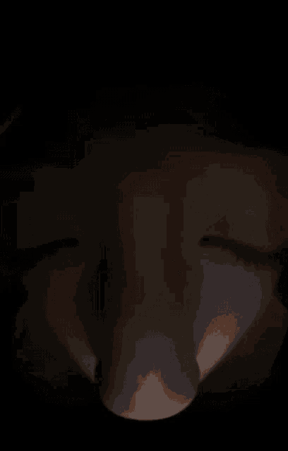 a close up of a person 's face with a yellow mask on .