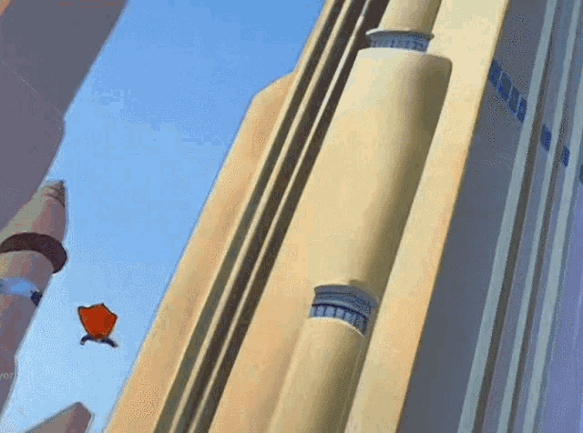 a cartoon character is flying through the air in front of a large building
