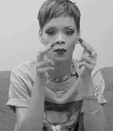 a black and white photo of a woman with short hair making a face