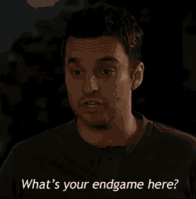 a man is asking what 's your endgame here while wearing a black shirt .
