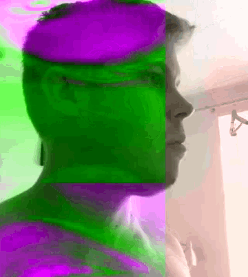 a purple and green image of a man 's head