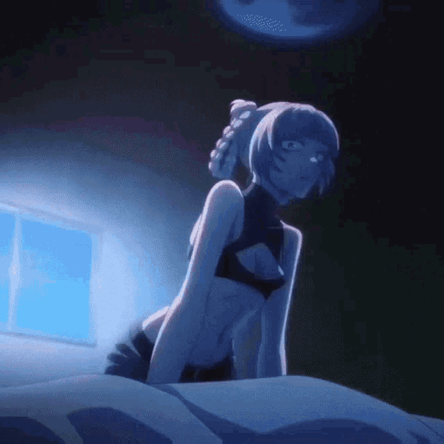 a girl in a bra is sitting on a bed in the dark