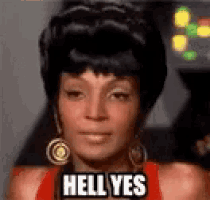 a woman is wearing a red dress and earrings and says `` hell yes '' .