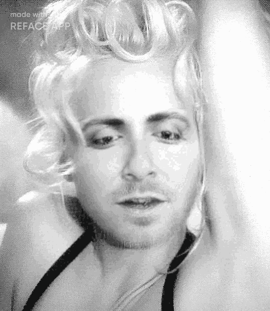 a black and white photo of a man with blonde hair and a beard made with reface app