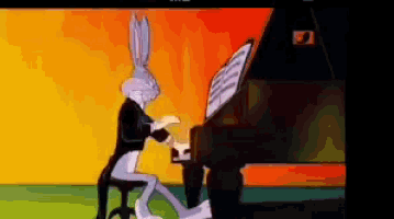 bugs bunny playing a piano in a cartoon