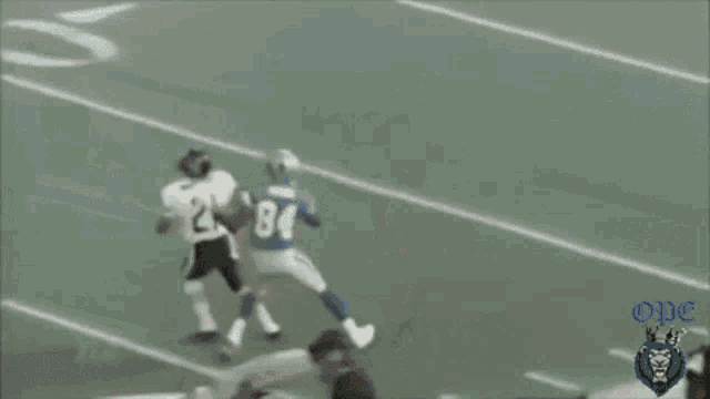 a referee with the number 90 on his jersey stands on the field