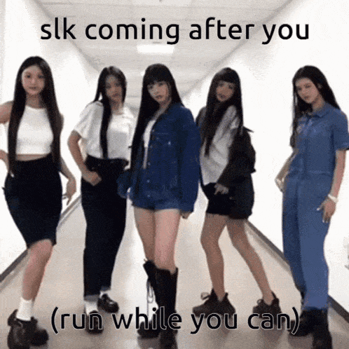 a group of girls standing in a hallway with the caption " slk coming after you "