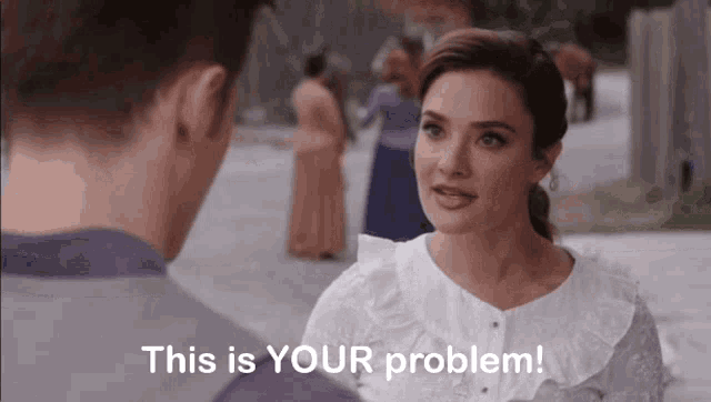 a woman talking to a man with the words " this is your problem " above her