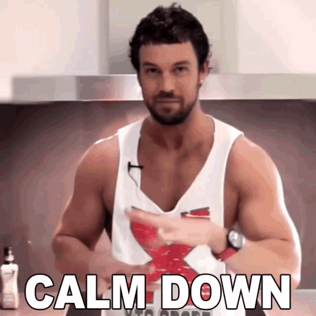 a man in a white tank top with the words calm down on it