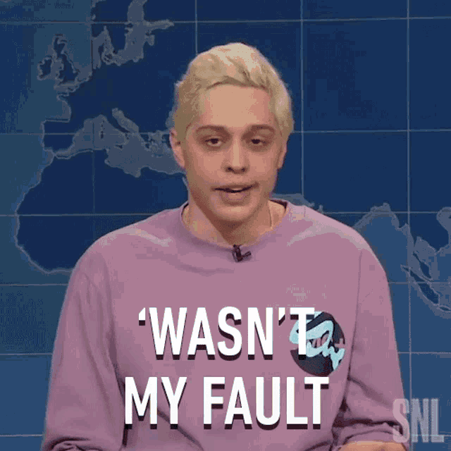 a man in a purple shirt says wasn 't my fault