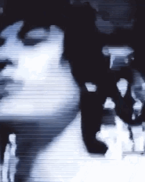 a blurry picture of a person 's face with a few lines visible