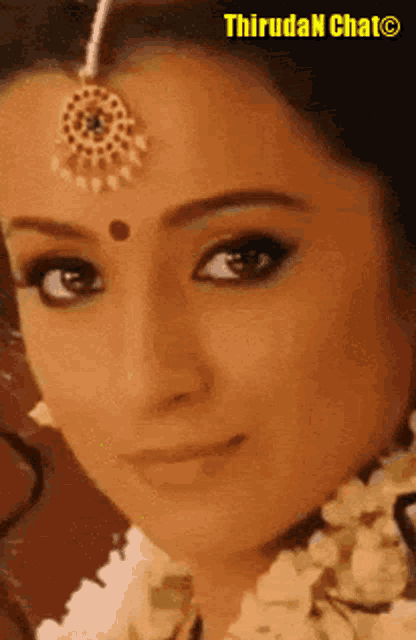a close up of a woman 's face with the words thiruda n chat on the bottom