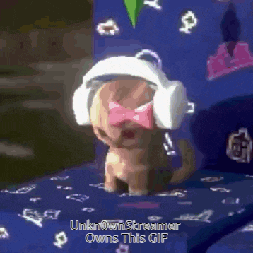 a small puppy wearing headphones and a bow tie