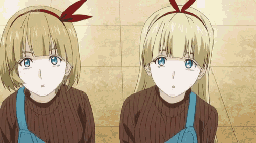 two anime girls are sitting next to each other on a tile floor