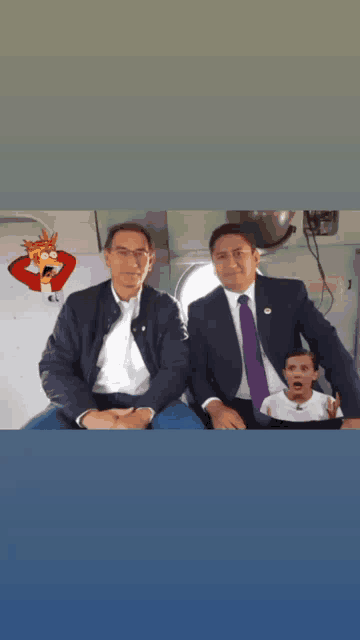 two men in suits and ties are sitting next to each other in an airplane with a cartoon character on the wall behind them .
