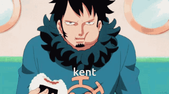 a man in a blue sweater with kent written on it