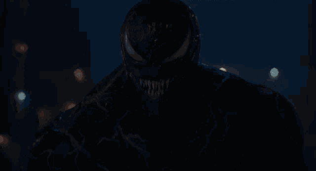 a man with a crown on his head is covered in venom