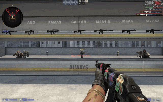 a person holding a gun in front of a wall that has always written on it