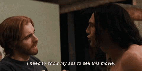 two men are talking to each other and one of them is saying i need to show my ass to sell this movie