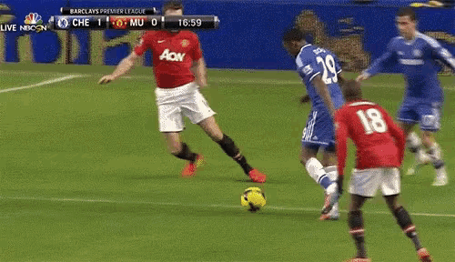 a soccer game is being played in front of a barclays advertisement
