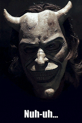 a poster with a devil mask and the words nuh-uh on it