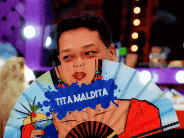 a fan with a picture of a woman and the word tita maldita on it