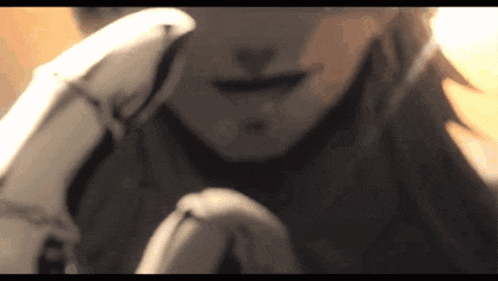 a close up of a woman 's face with a hand behind her head