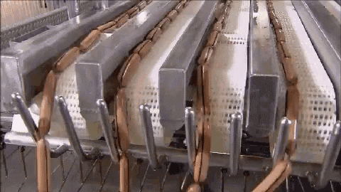 a bunch of sausages are being processed in a machine