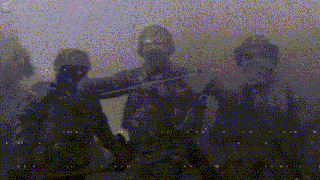 a group of soldiers are standing in a foggy area