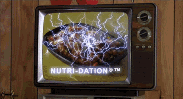 a television screen shows a plate of food and the words nutri-dation
