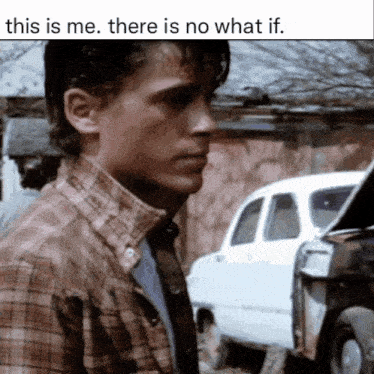 a man in a plaid shirt is standing in front of a white car with the words this is me there is no what if