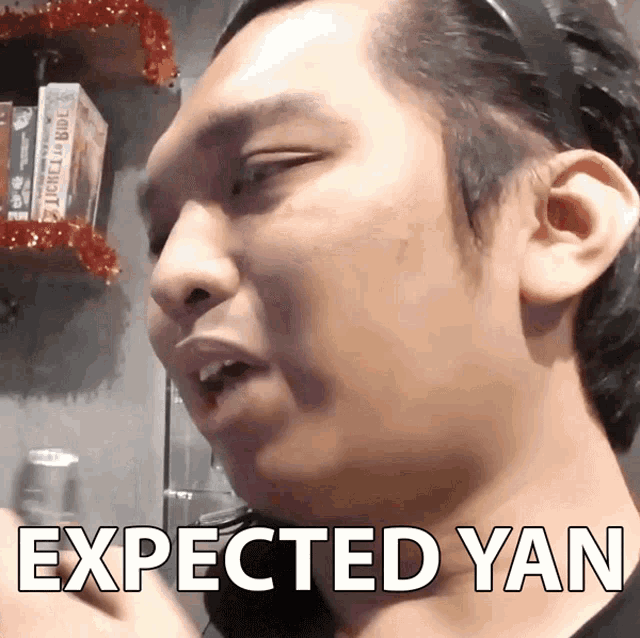 a close up of a man 's face with the words expected yan written on it