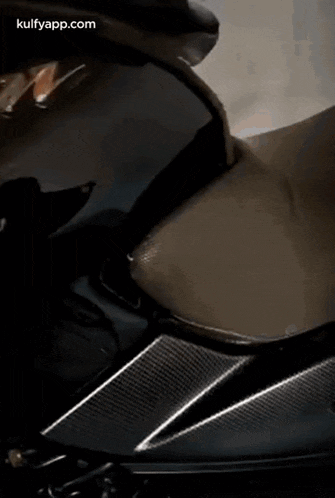 a close up of a motorcycle 's seat and fender .