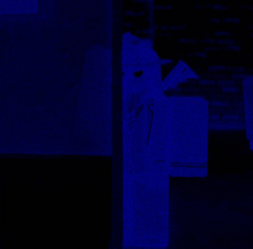 a blue background with a brick wall in the background and a box that says ' a ' on it