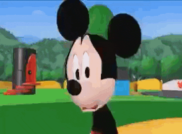 a close up of mickey mouse 's face in a cartoon scene