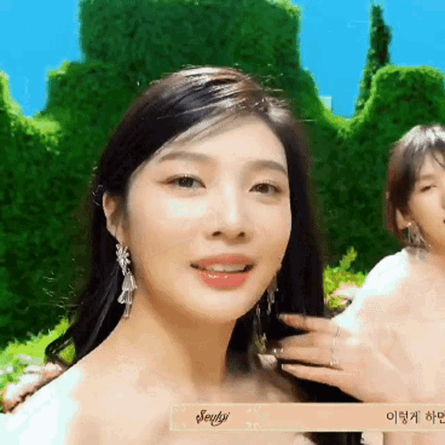 a close up of a woman 's face with a sign that says seulgi