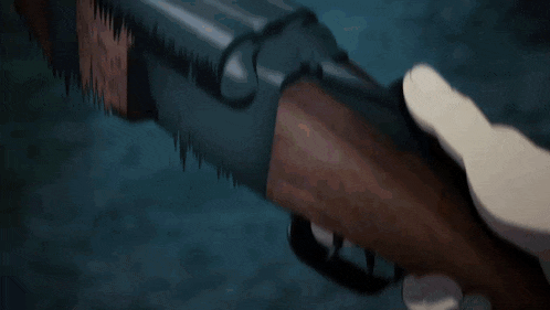 a person holding a shotgun in their hand with a dark background