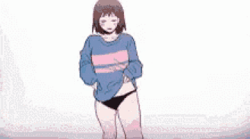 a girl in a blue sweater is smiling and looking down .