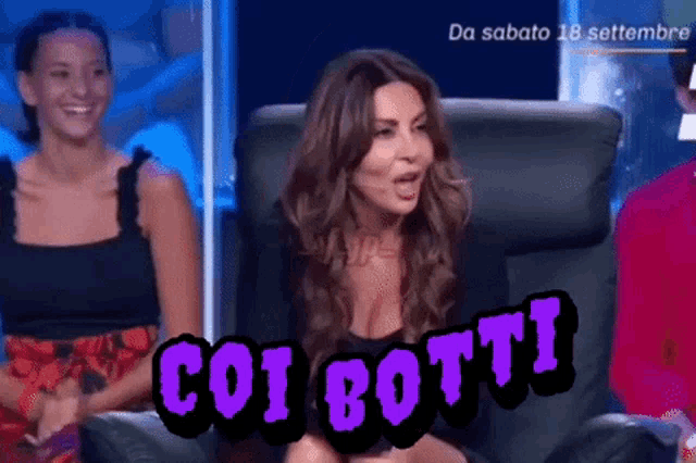a woman is sitting in a chair with a purple sign that says " coi botti " on it