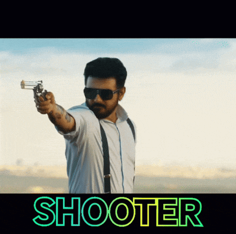 a man is pointing a gun with the word shooter behind him