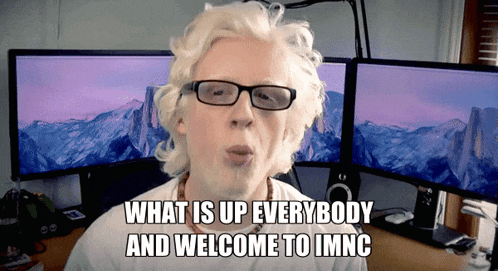 a man wearing glasses and a white shirt says what is up everybody and welcome to imnc