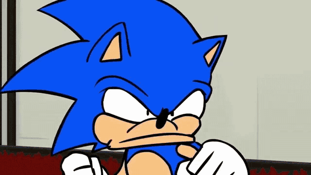 a cartoon of sonic the hedgehog with an angry look on his face .